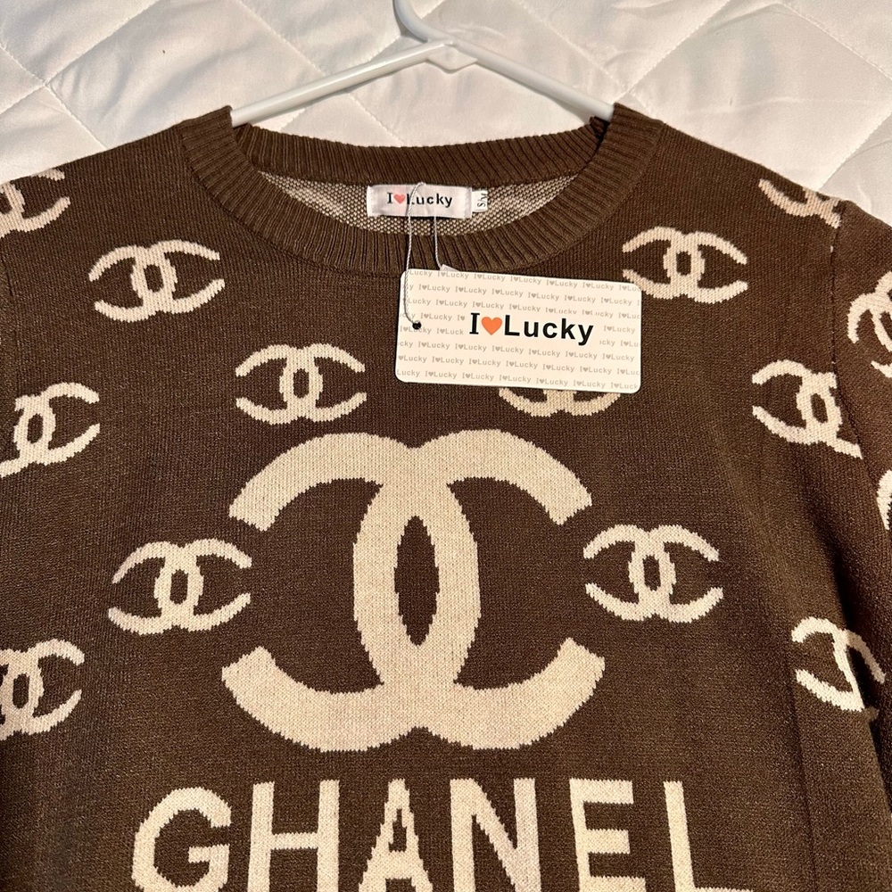Nice, thin light weight, brown sweater, new with tags.